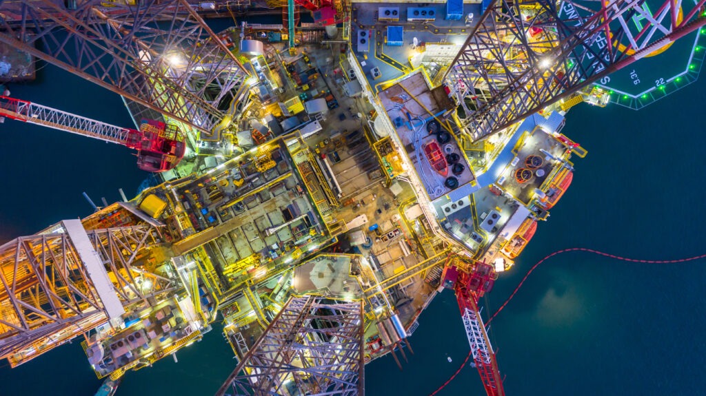 Aerial,view,offshore,jack,up,rig,at,night,,offshore,oil